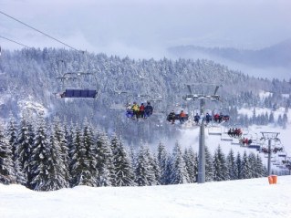 Skiers on chair lift 06' 0107_14